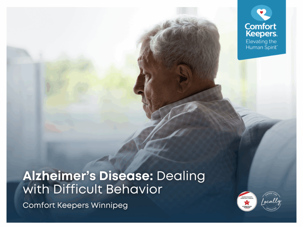 A senior man is seated in front of a window, seemingly sad | Alzheimer’s Disease: Dealing with Difficult Behaviour | Comfort Keepers Winnipeg